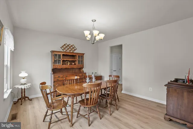 a kitchen with stove a sink dishwasher and a refrigerator