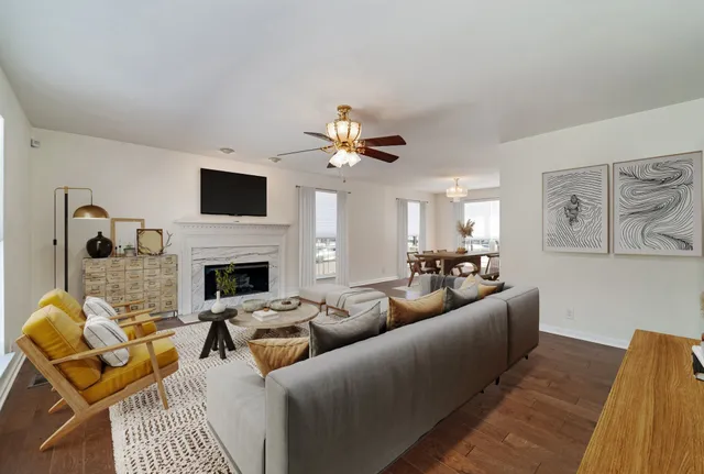 a living room with furniture fireplace and a flat screen tv