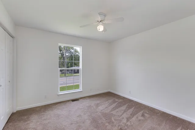 a view of an empty room with a window