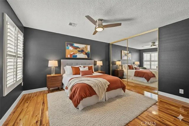 a bedroom with bed and window