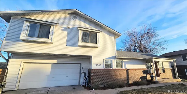 a view of a house with a garage