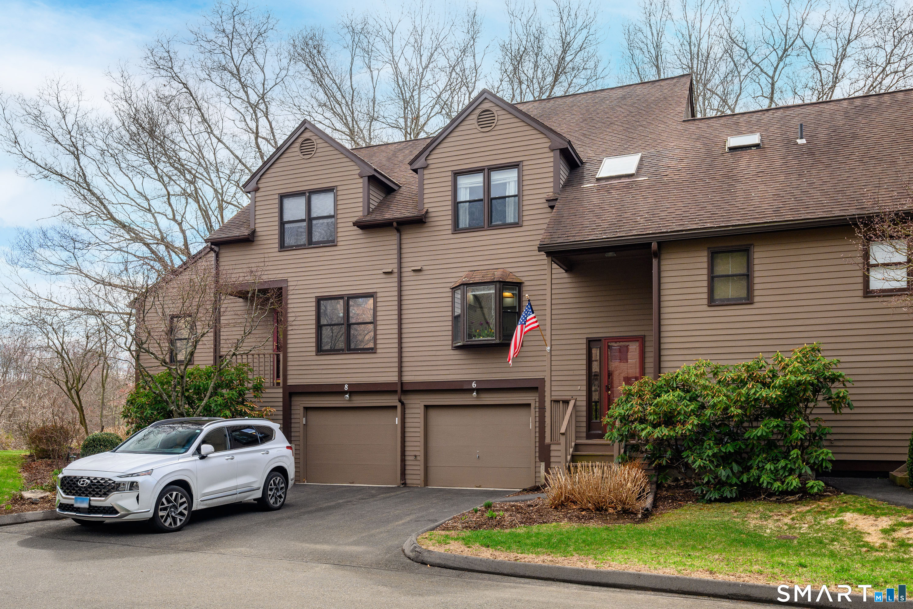 6 Echowoods Circle, Unit 6 Monroe, CT 06468 - Photo 1 of 25 a view of a car parked in front of a house