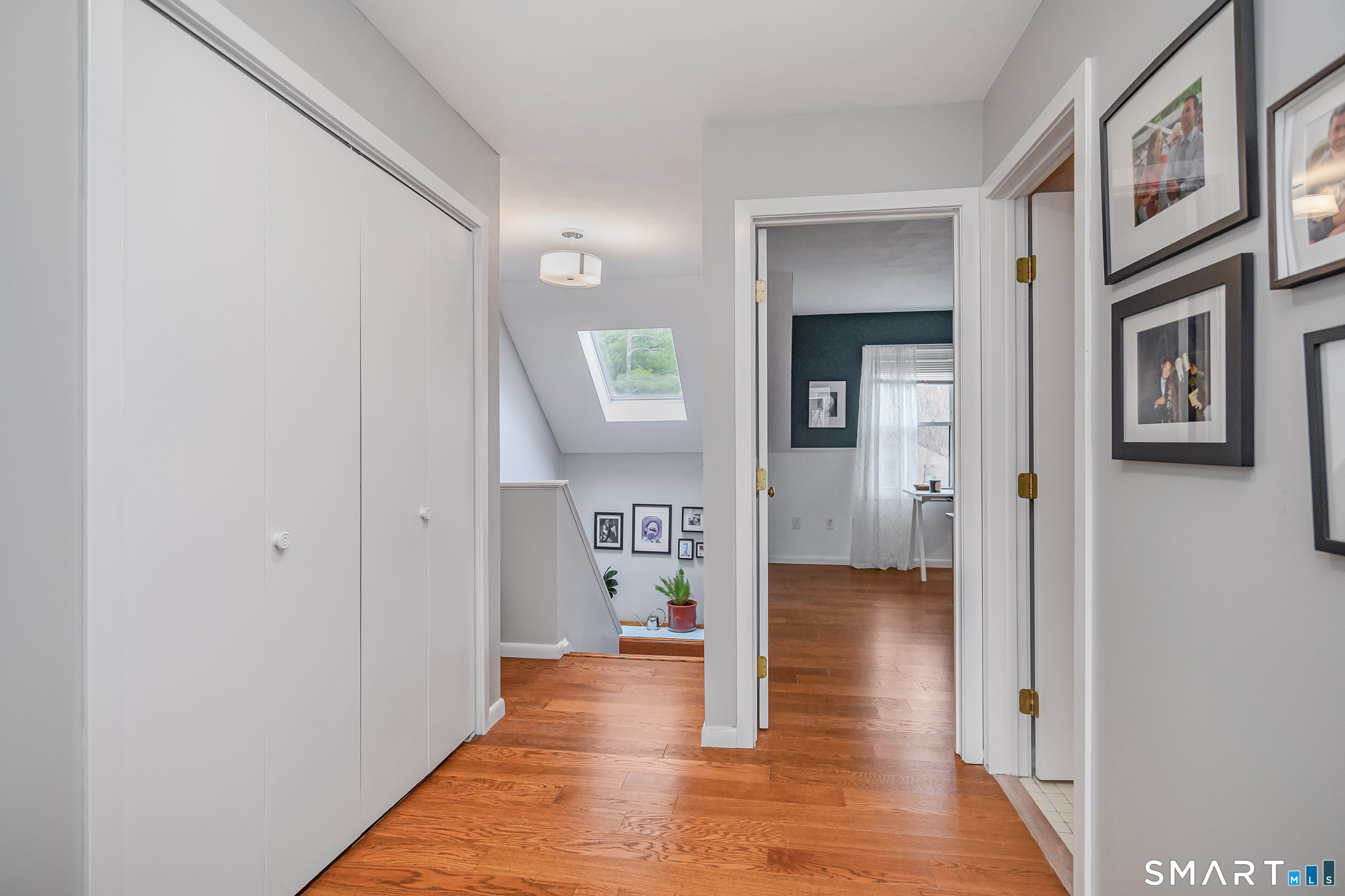 6 Echowoods Circle, Unit 6 Monroe, CT 06468 - Photo 13 of 25 a view of a hallway with wooden floor