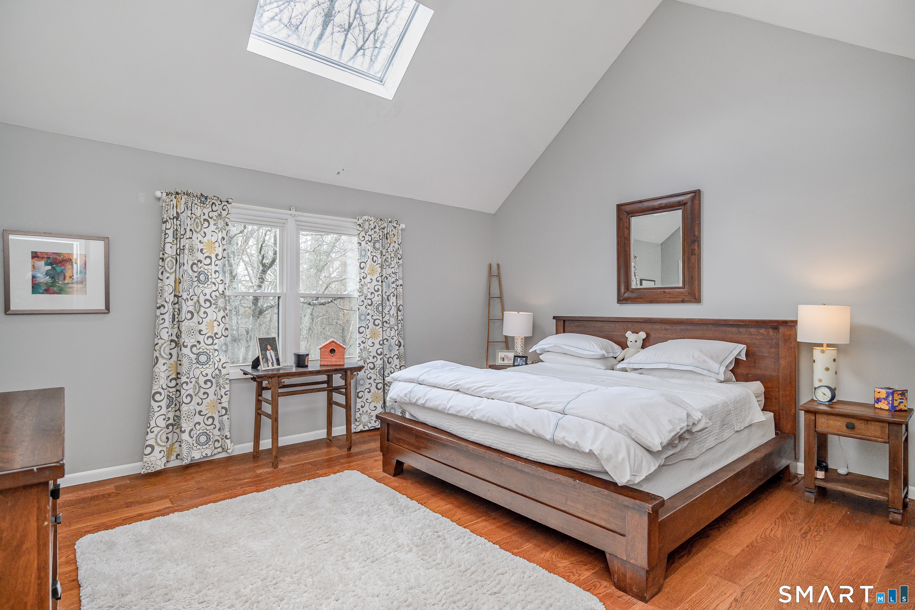 6 Echowoods Circle, Unit 6 Monroe, CT 06468 - Photo 14 of 25 a bedroom with a bed wooden floor and a window