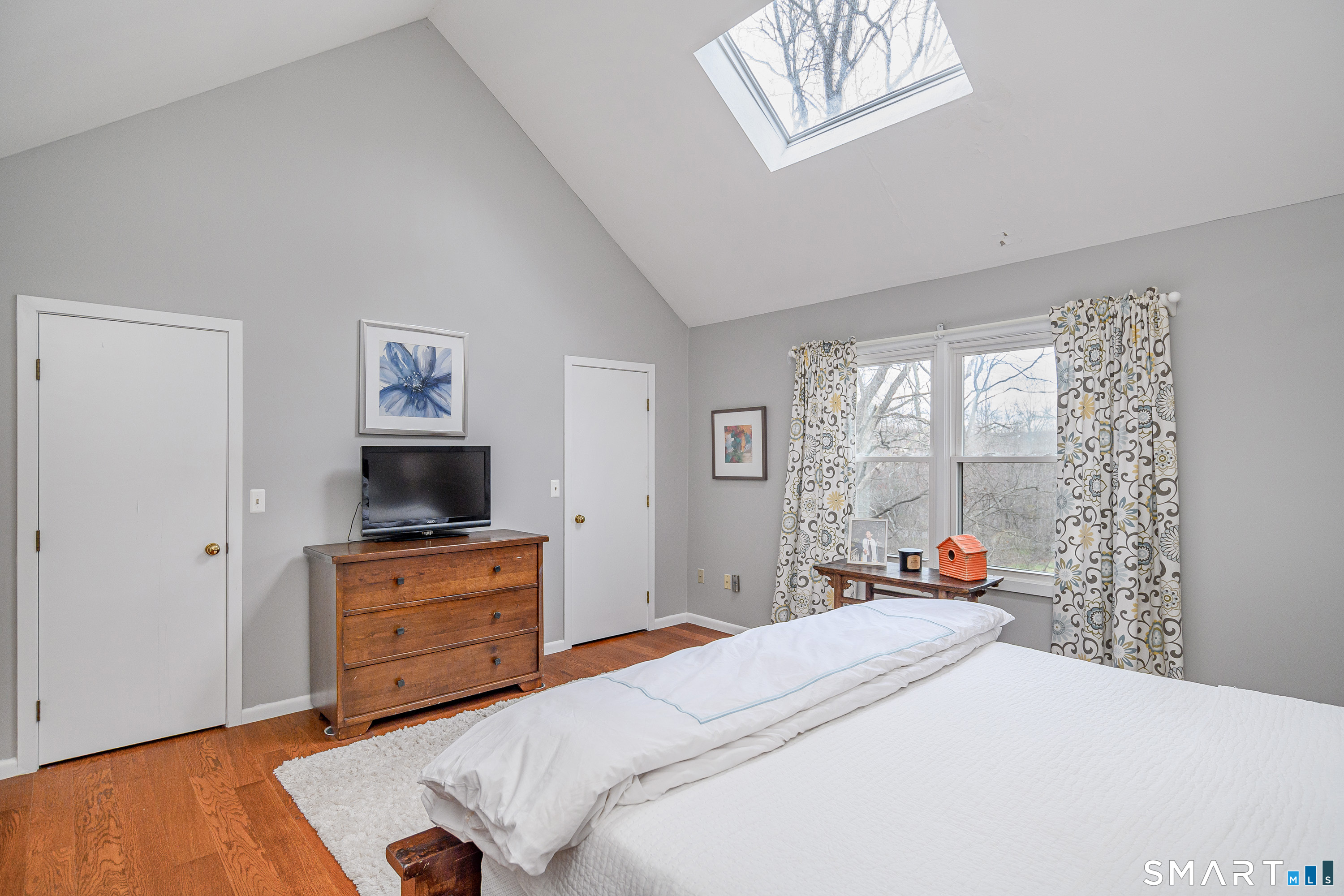 6 Echowoods Circle, Unit 6 Monroe, CT 06468 - Photo 15 of 25 a bedroom with a bed and a flat screen tv