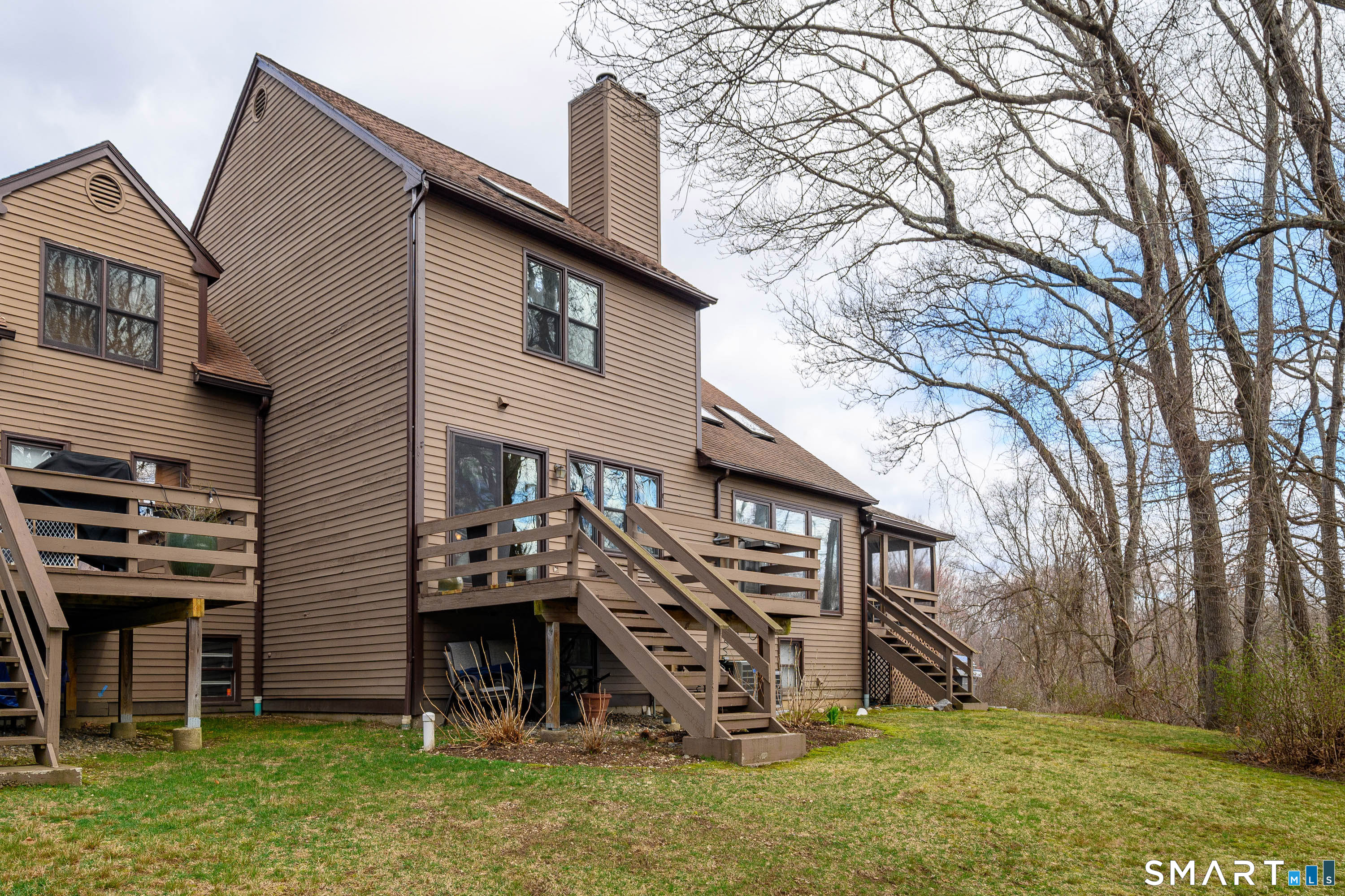6 Echowoods Circle, Unit 6 Monroe, CT 06468 - Photo 23 of 25 a view of a house with a yard and a large tree