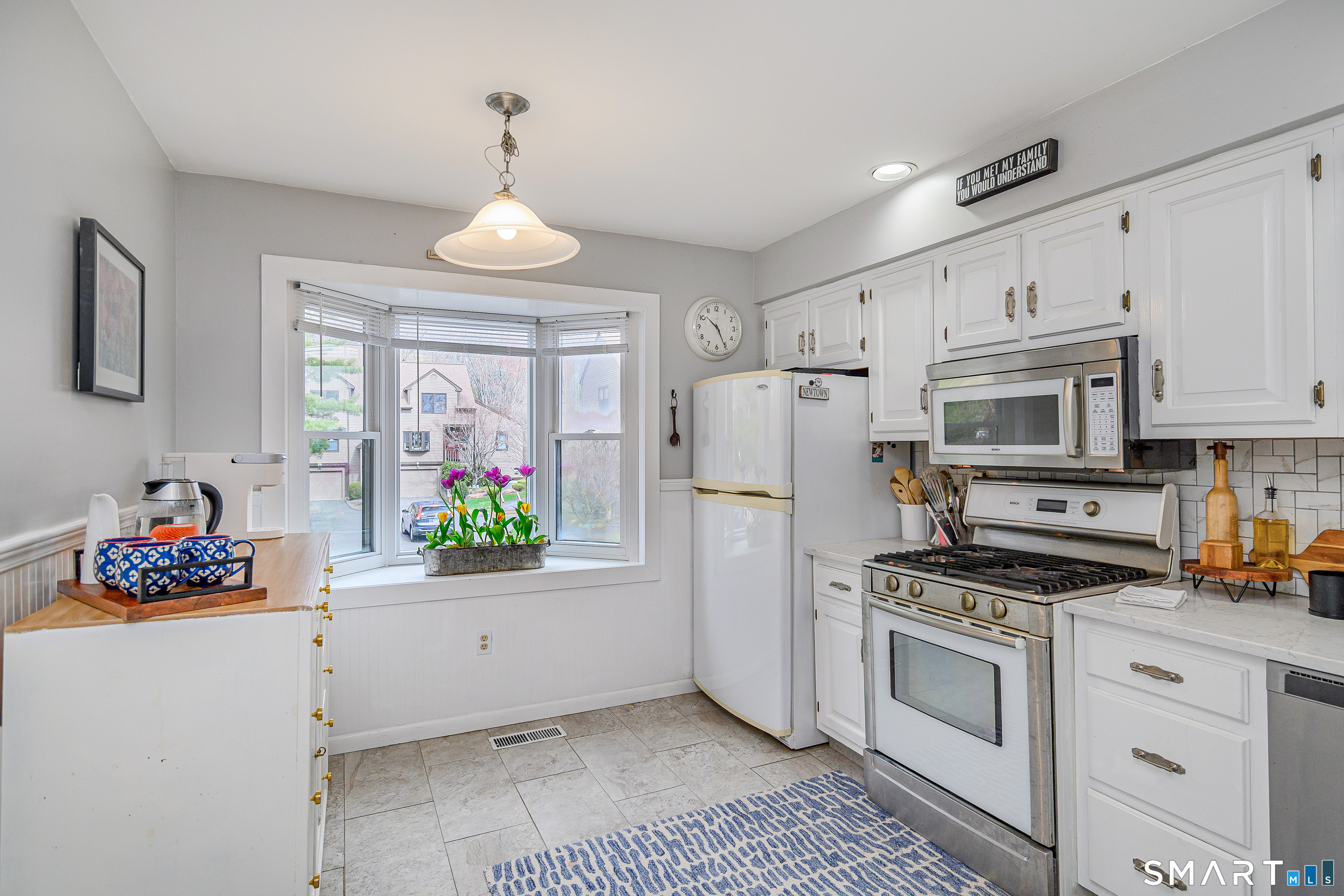 6 Echowoods Circle, Unit 6 Monroe, CT 06468 - Photo 3 of 25 a kitchen with white cabinets and white appliances