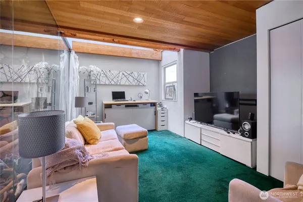a view of entryway with wooden floor and a front door