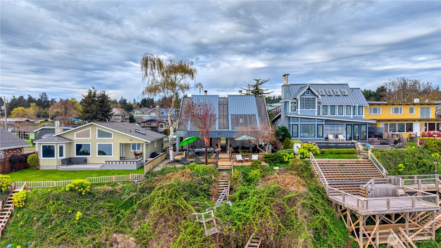 731 Kendor Drive Point Roberts, WA 98281 - Photo 35 of 40 a front view of residential houses with yard and green space