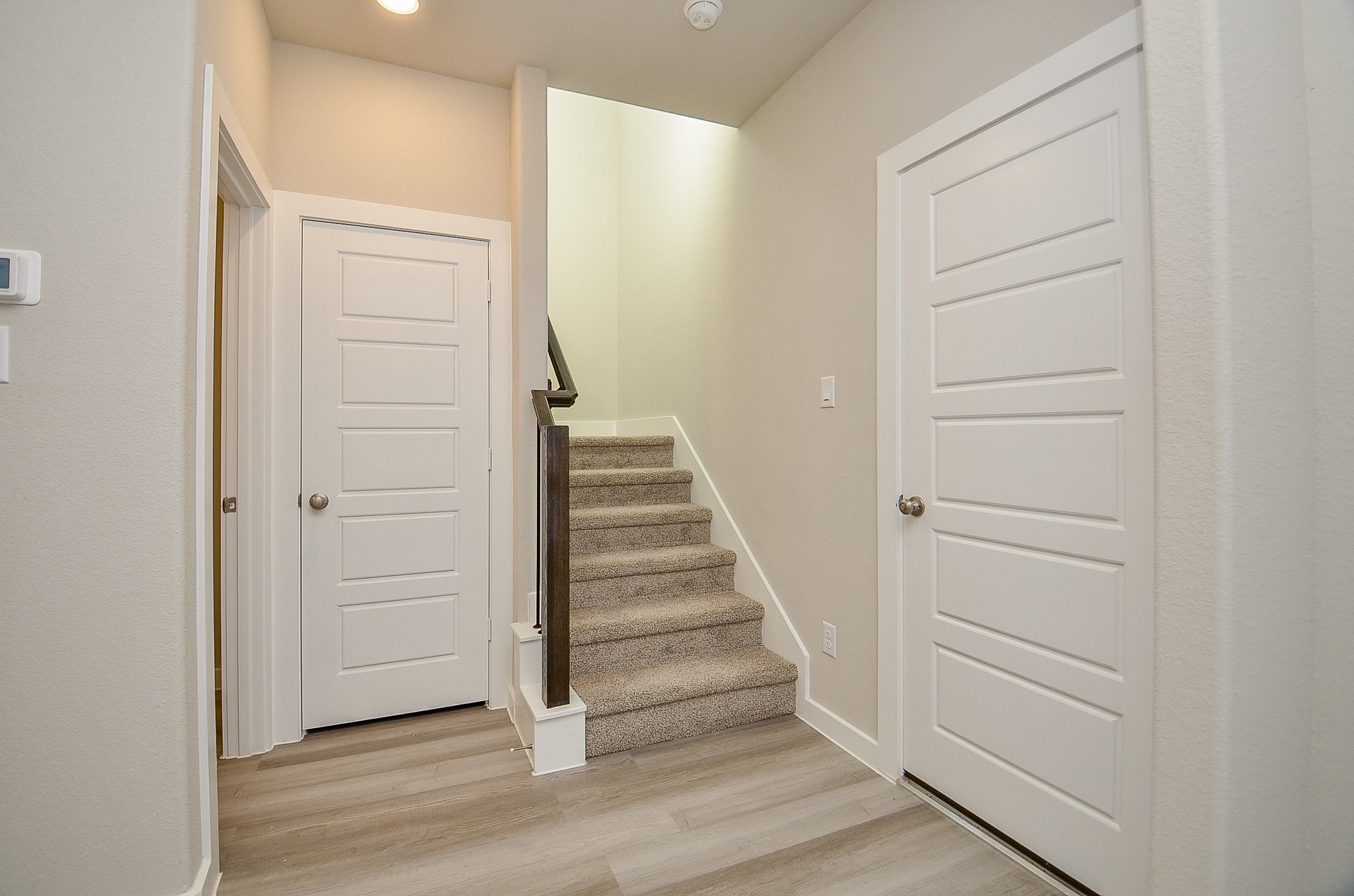 3107 Boulder Rnch Drive Houston, TX 77063 - Photo 19 of 40 a view of a hallway with wooden floor and entryway