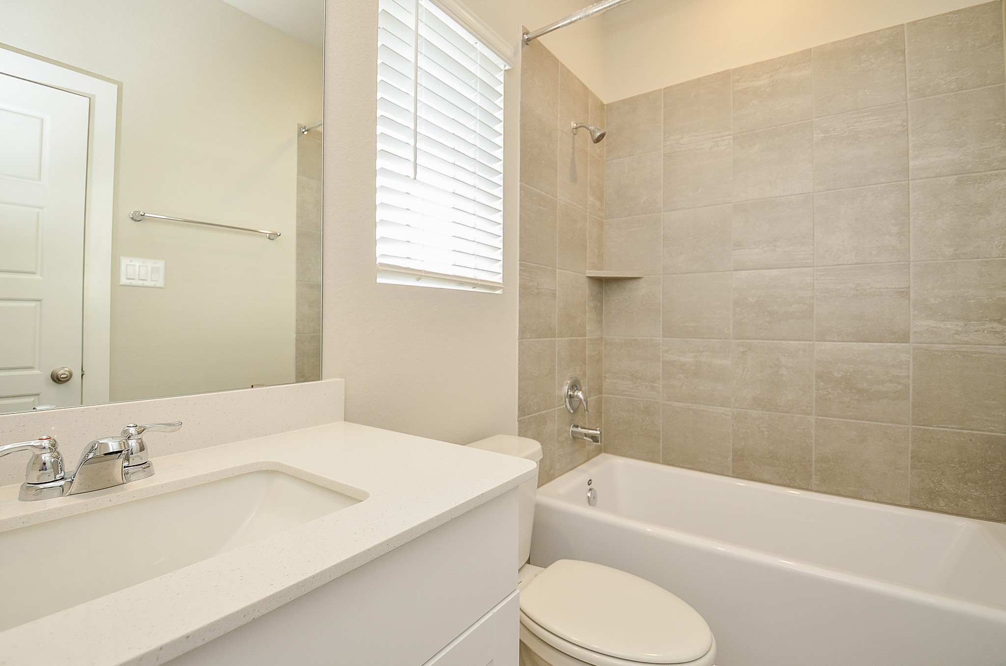 3107 Boulder Rnch Drive Houston, TX 77063 - Photo 29 of 40 a bathroom with a granite countertop sink toilet and bathtub
