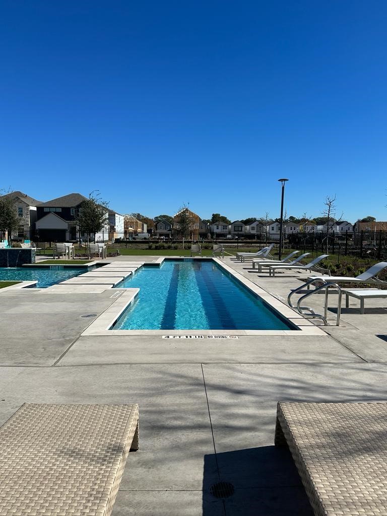 3107 Boulder Rnch Drive Houston, TX 77063 - Photo 36 of 40 a view of a swimming pool with a lounge chairs