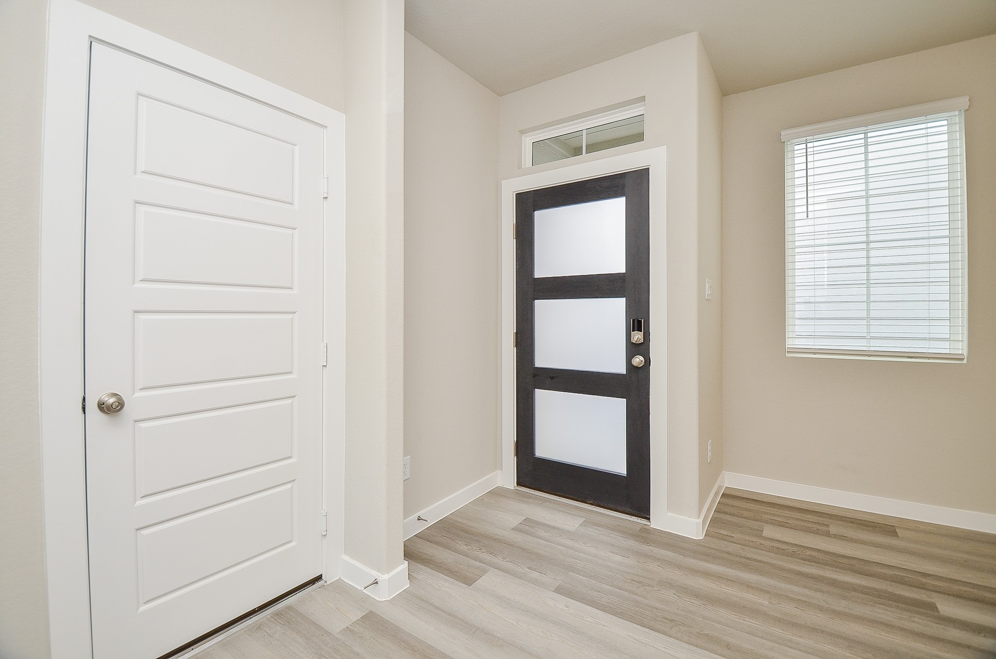 3107 Boulder Rnch Drive Houston, TX 77063 - Photo 9 of 40 an empty room with wooden floor closet and windows