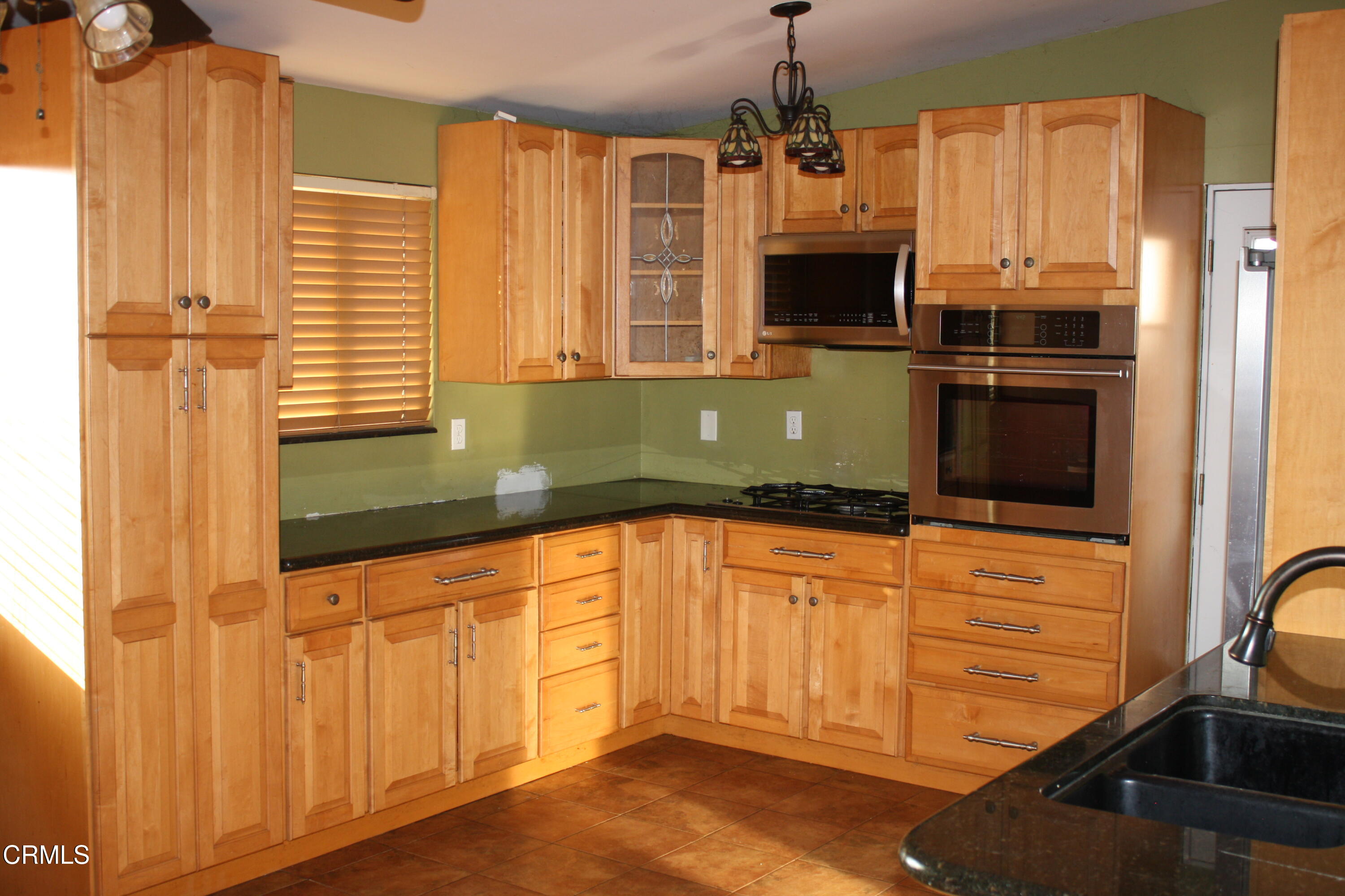 3500 Madera Place Oxnard, CA 93033 - Photo 2 of 9 a bathroom with a sink a bathtub and a window