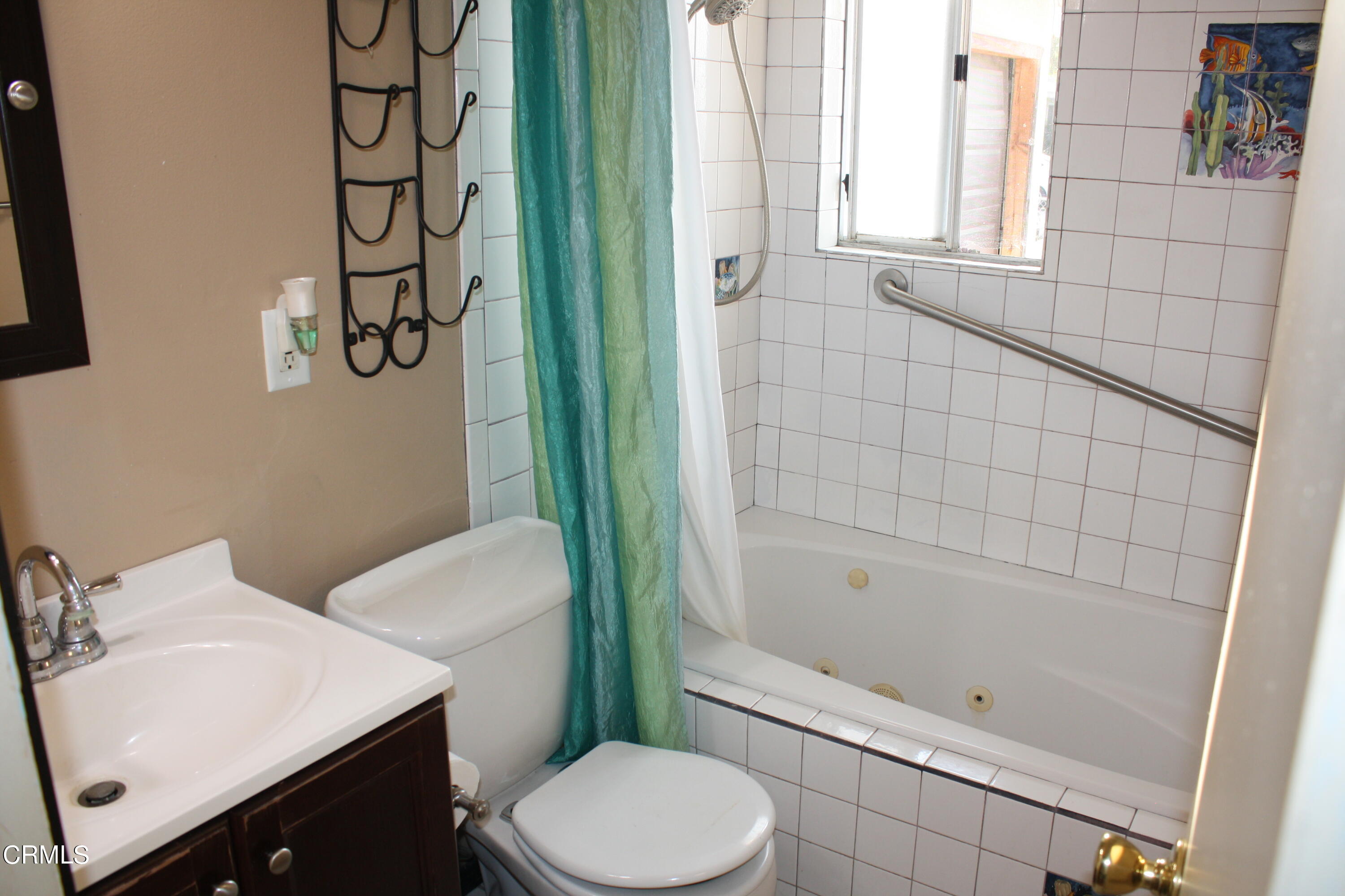 3500 Madera Place Oxnard, CA 93033 - Photo 6 of 9 a bathroom with a sink toilet and shower