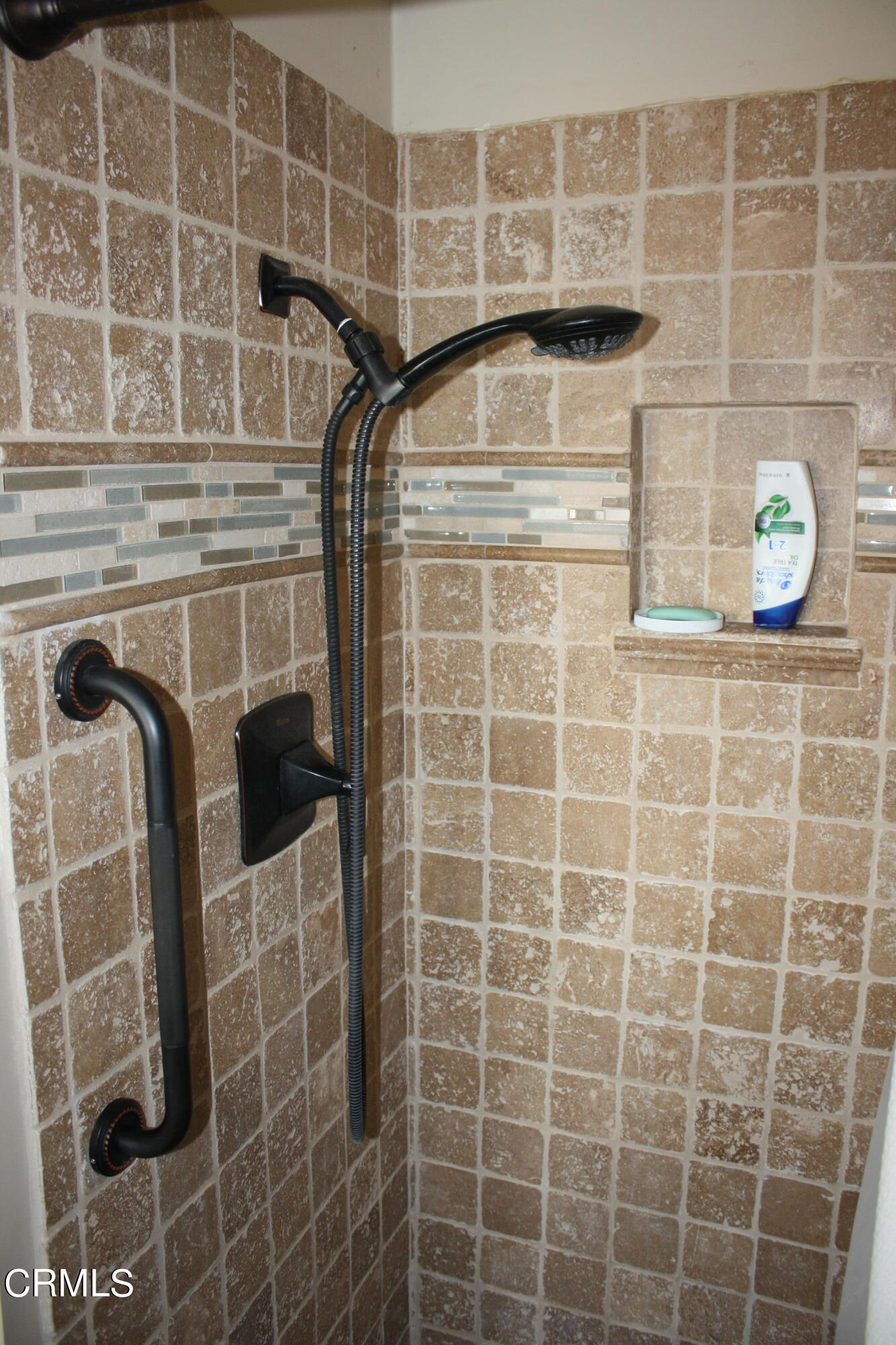 3500 Madera Place Oxnard, CA 93033 - Photo 8 of 9 a bathroom with a shower and a mirror