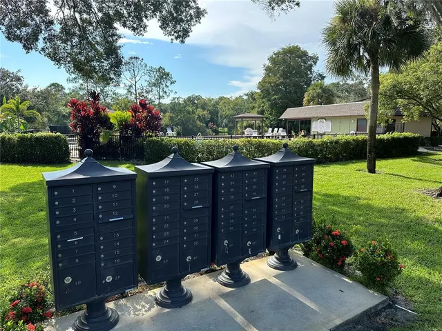 a view of a house with a yard and garden