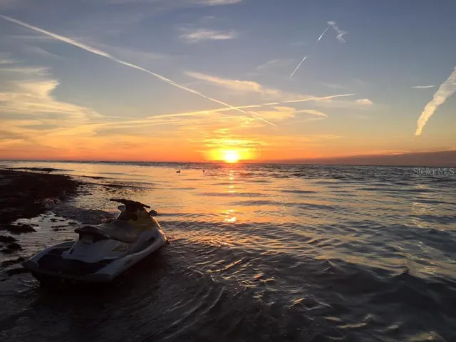 a view of a lake with a yard