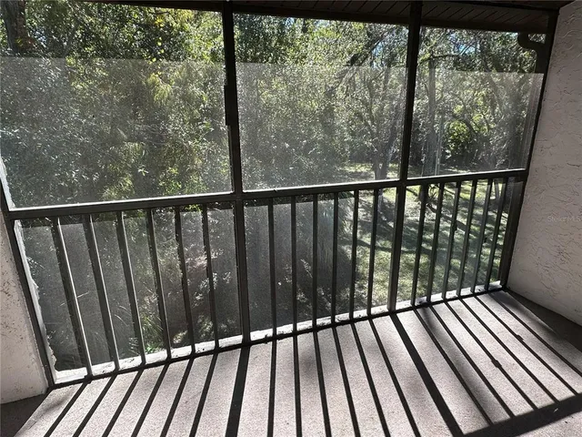 a view of balcony with wooden floor