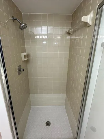 a bathroom with a shower and a bathtub