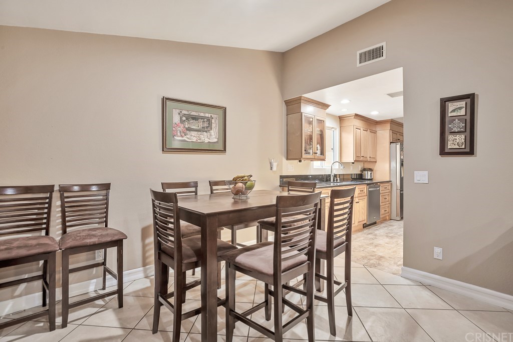 20610 Gresham Street Winnetka, CA 91306 - Photo 12 of 33 a view of a dining room with furniture