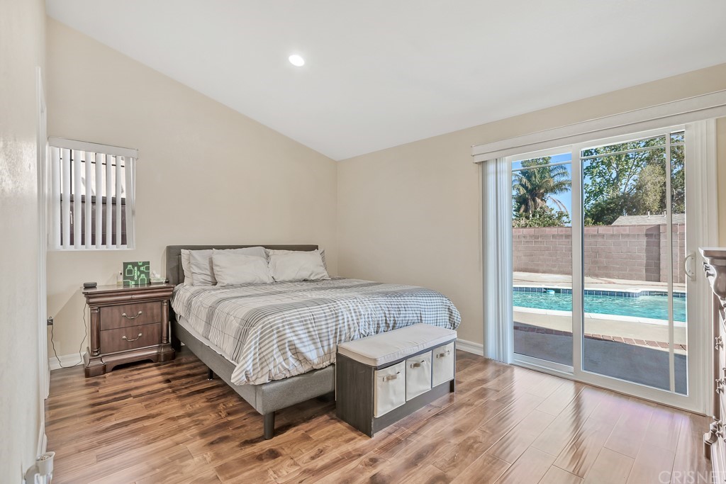 20610 Gresham Street Winnetka, CA 91306 - Photo 13 of 33 a bedroom with a large bed and a view of bedroom