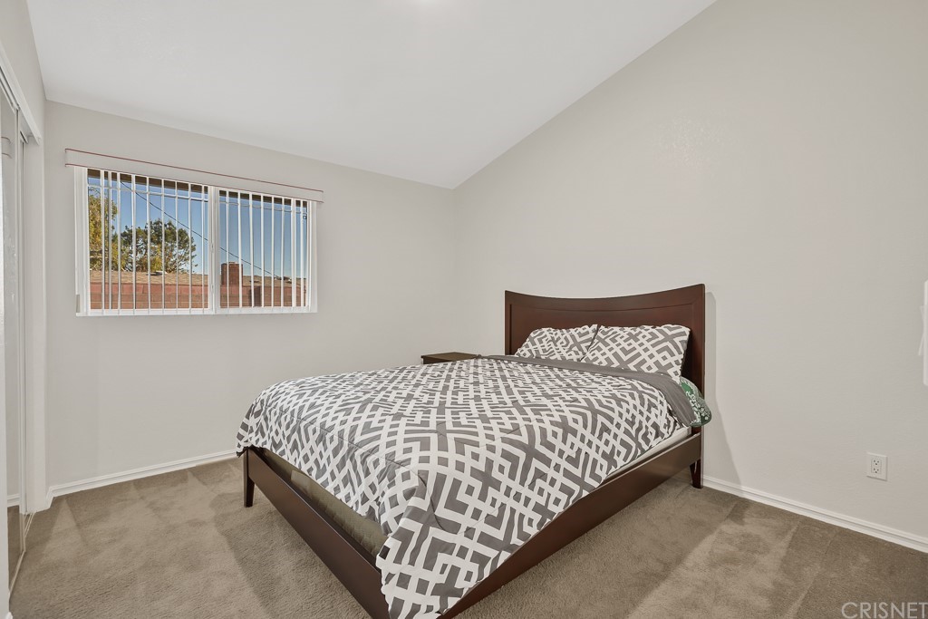 20610 Gresham Street Winnetka, CA 91306 - Photo 18 of 33 a bedroom with a bed and window