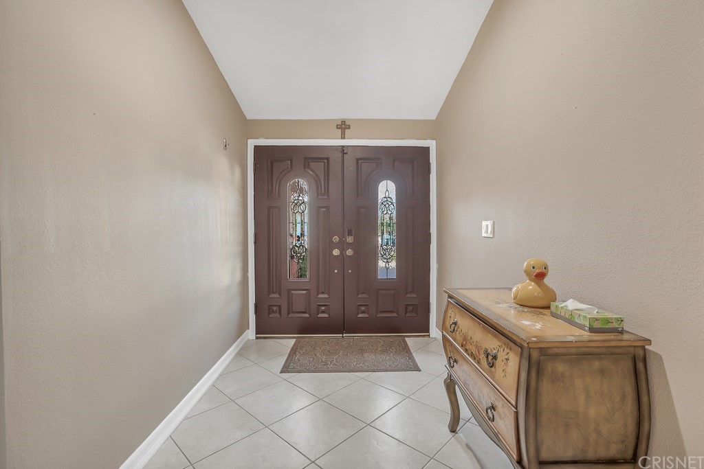 20610 Gresham Street Winnetka, CA 91306 - Photo 2 of 33 a view of entryway with front door