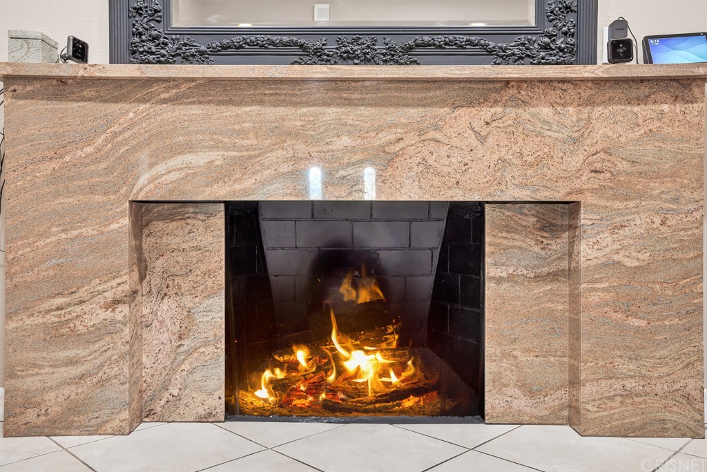 20610 Gresham Street Winnetka, CA 91306 - Photo 7 of 33 a room with water heater and wooden cabinet