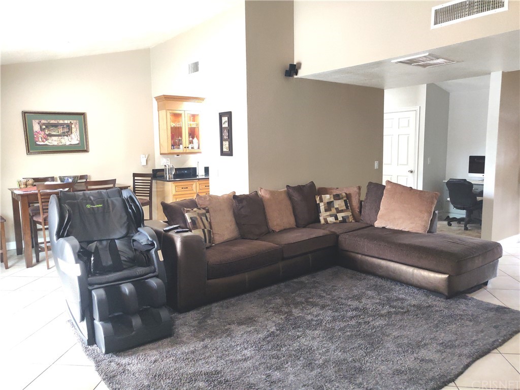 20610 Gresham Street Winnetka, CA 91306 - Photo 8 of 33 a living room with furniture and wooden floor