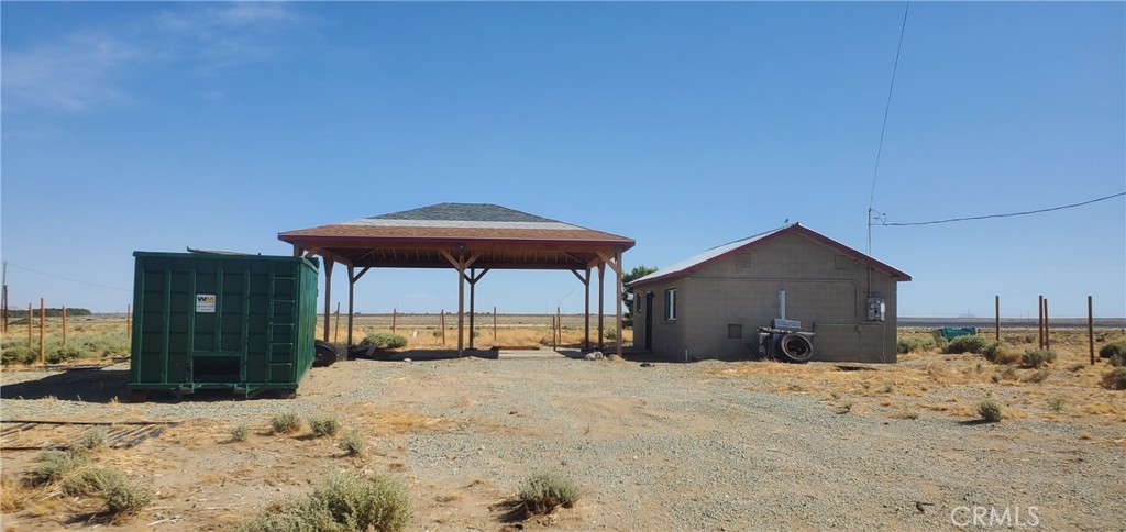 7634 Cinnabar Road Mojave, CA 93501 - Photo 2 of 8 a view of a backyard of a house