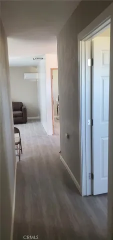 a view of a hallway to a room