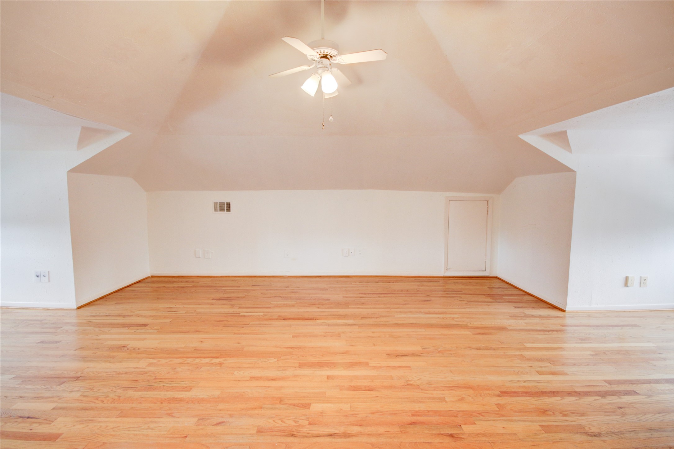 239 Westheimer Road Houston, TX 77006 - Photo 33 of 50 TOP FLOOR:Upstairs, the media room is defined by its soaring vaulted ceilings, creating an airy, expansive feel. Its versatile layout allows for countless uses, all while remaining tucked away from the rest of the home for added privacy
