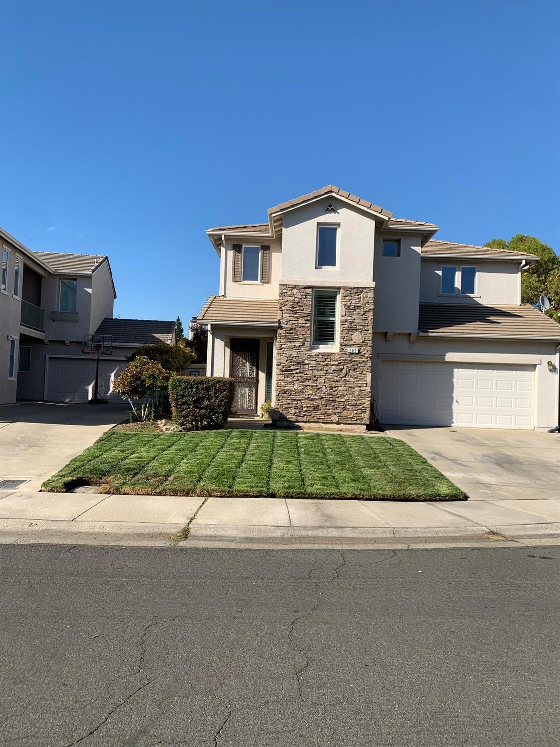 281 Barnhart Circle Sacramento, CA 95835 - Photo 1 of 12 a front view of a house with a yard
