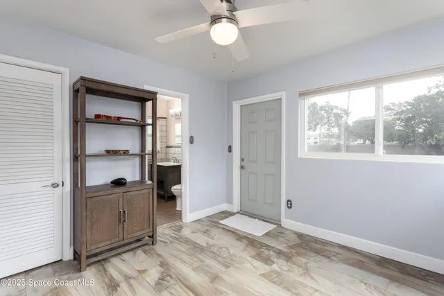 a view of an empty room with a window