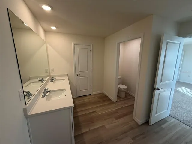 a bathroom with a sink and mirror