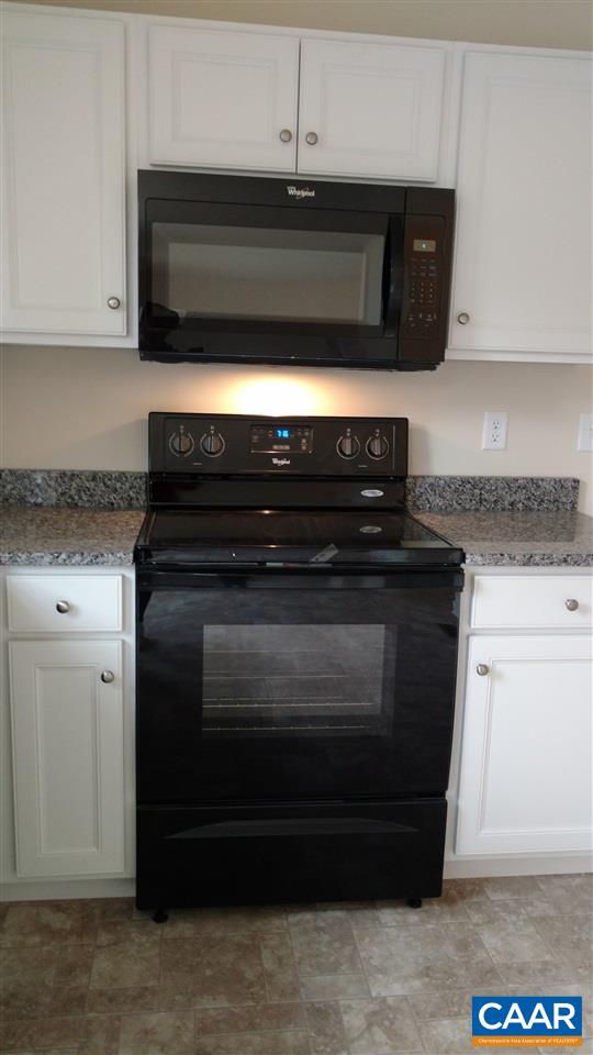 14 Tanglewood Road Palmyra, VA 22963 - Photo 8 of 27 a stove top oven sitting inside of a kitchen