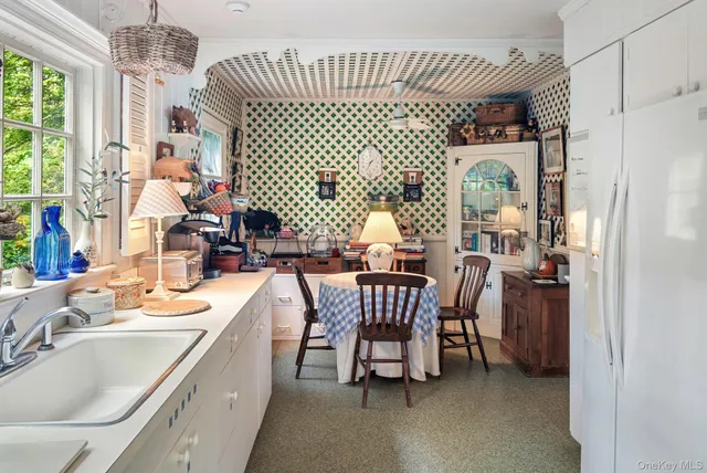 a dining room with furniture and window