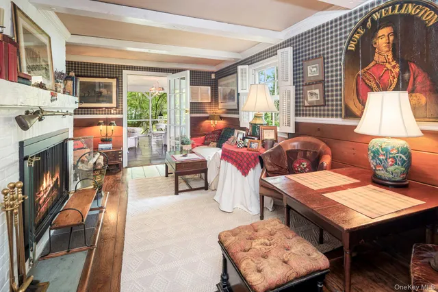 a living room with furniture and a lamp