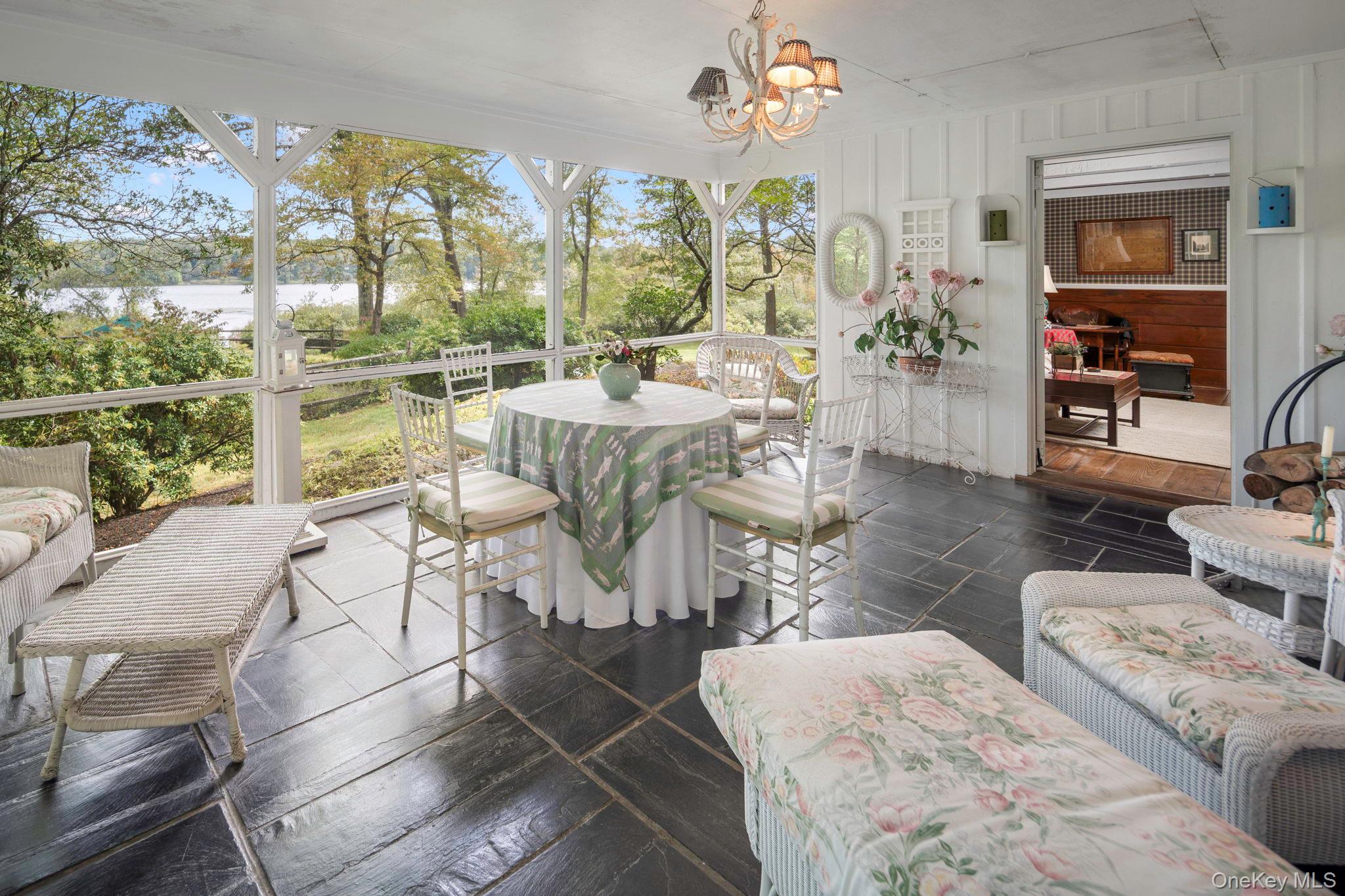 93 Cross Pond Road Pound Ridge, NY 10576 - Photo 16 of 44 a living room with furniture and a large window
