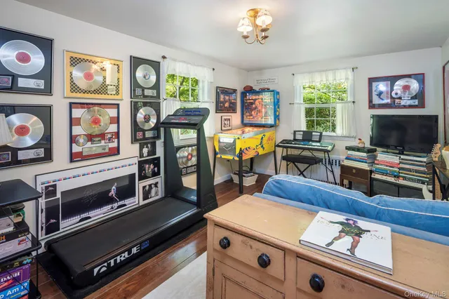 a room with furniture and a flat screen tv