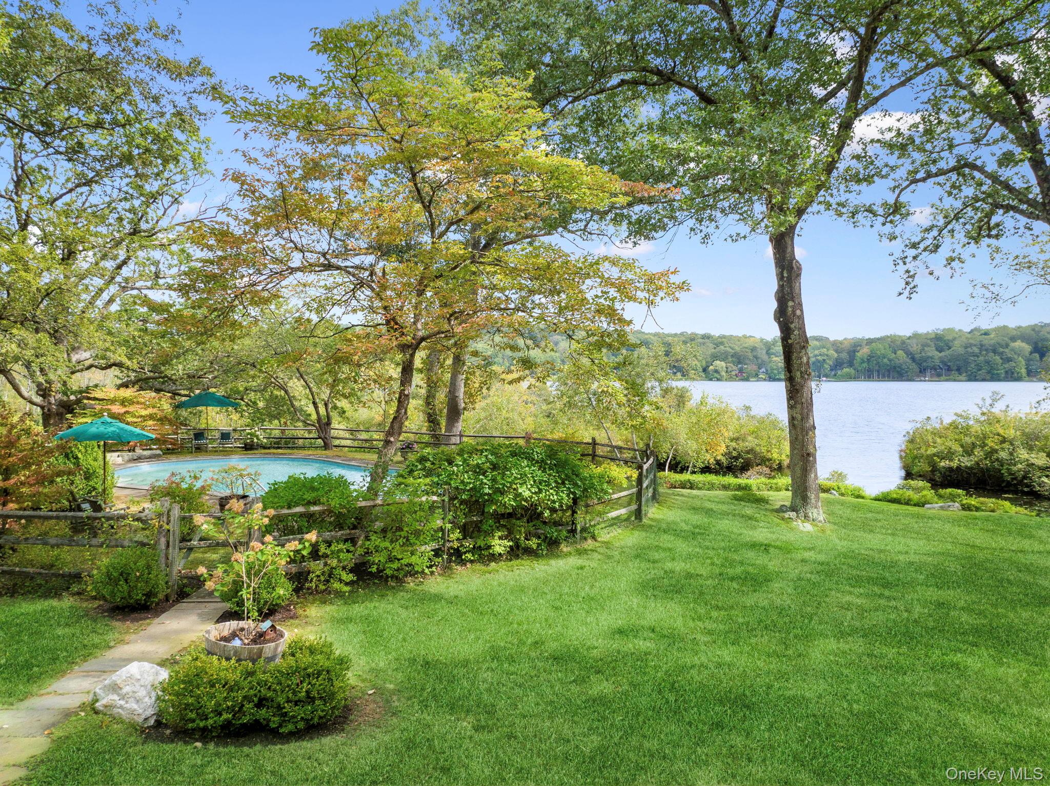 93 Cross Pond Road Pound Ridge, NY 10576 - Photo 27 of 44 a view of a garden with a tree