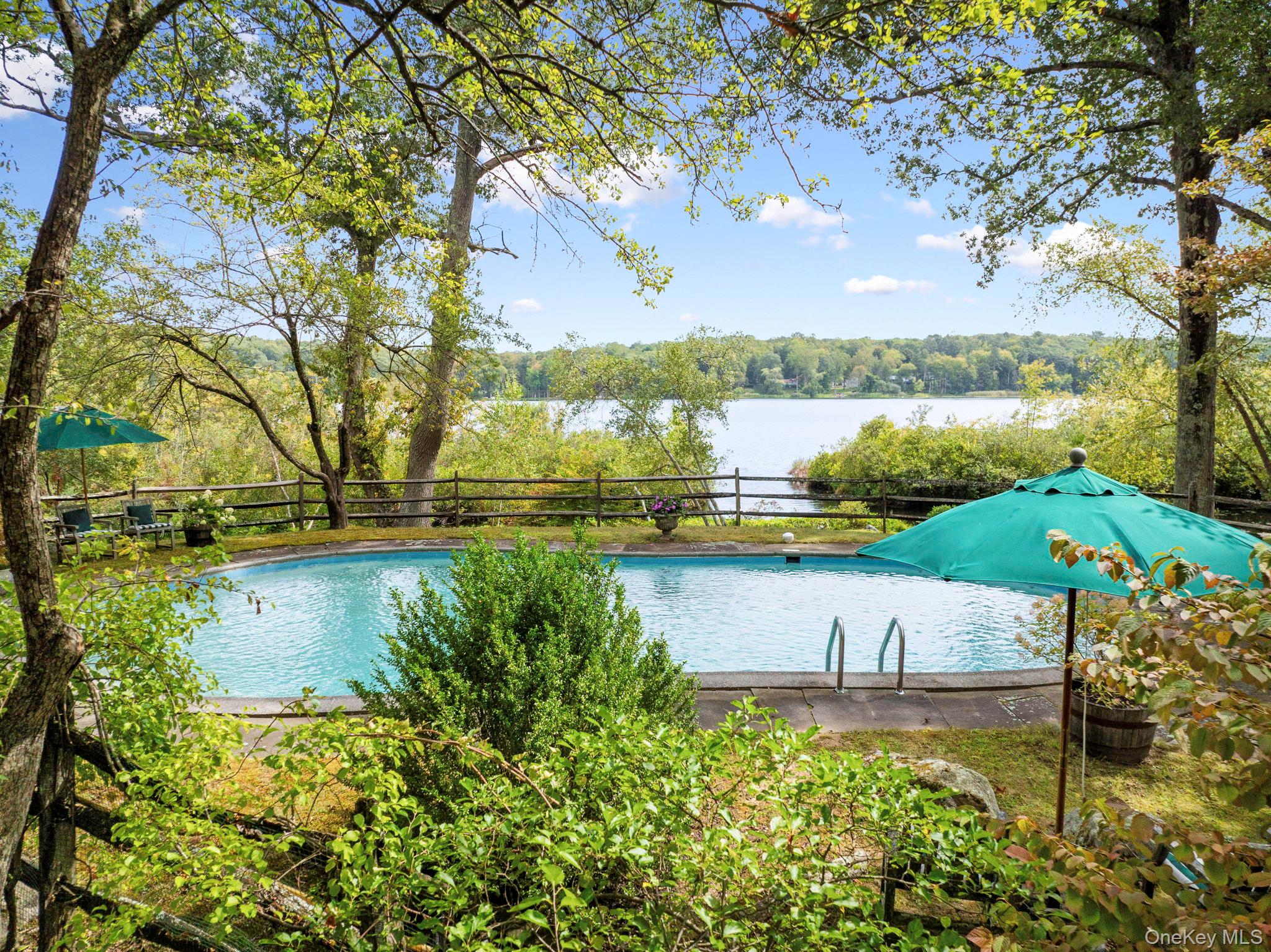 93 Cross Pond Road Pound Ridge, NY 10576 - Photo 28 of 44 a view of a lake with a big yard