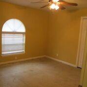 2109 Meadow Lane Grand Prairie, TX 75050 - Photo 15 of 17 an empty room with a window