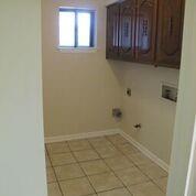 2109 Meadow Lane Grand Prairie, TX 75050 - Photo 7 of 17 a view of an empty room with a window