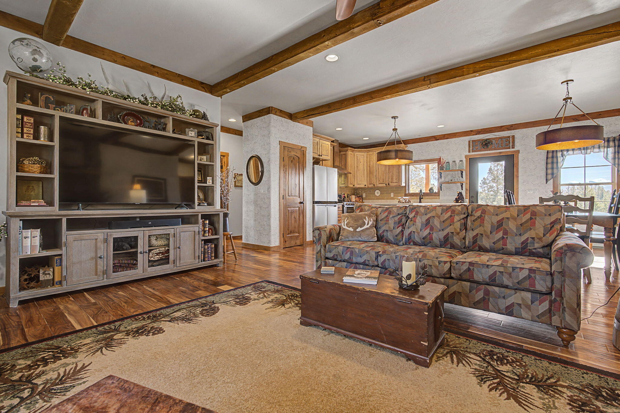 213 Big Canyon Point Ridgway, CO 81432 - Photo 4 of 41 a living room with furniture and a flat screen tv