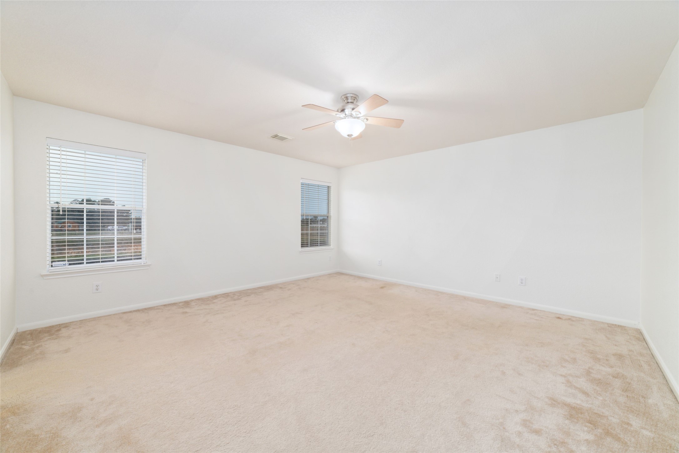 21311 Shadow River Lane Spring, TX 77379 - Photo 29 of 38 an empty room with windows and fan