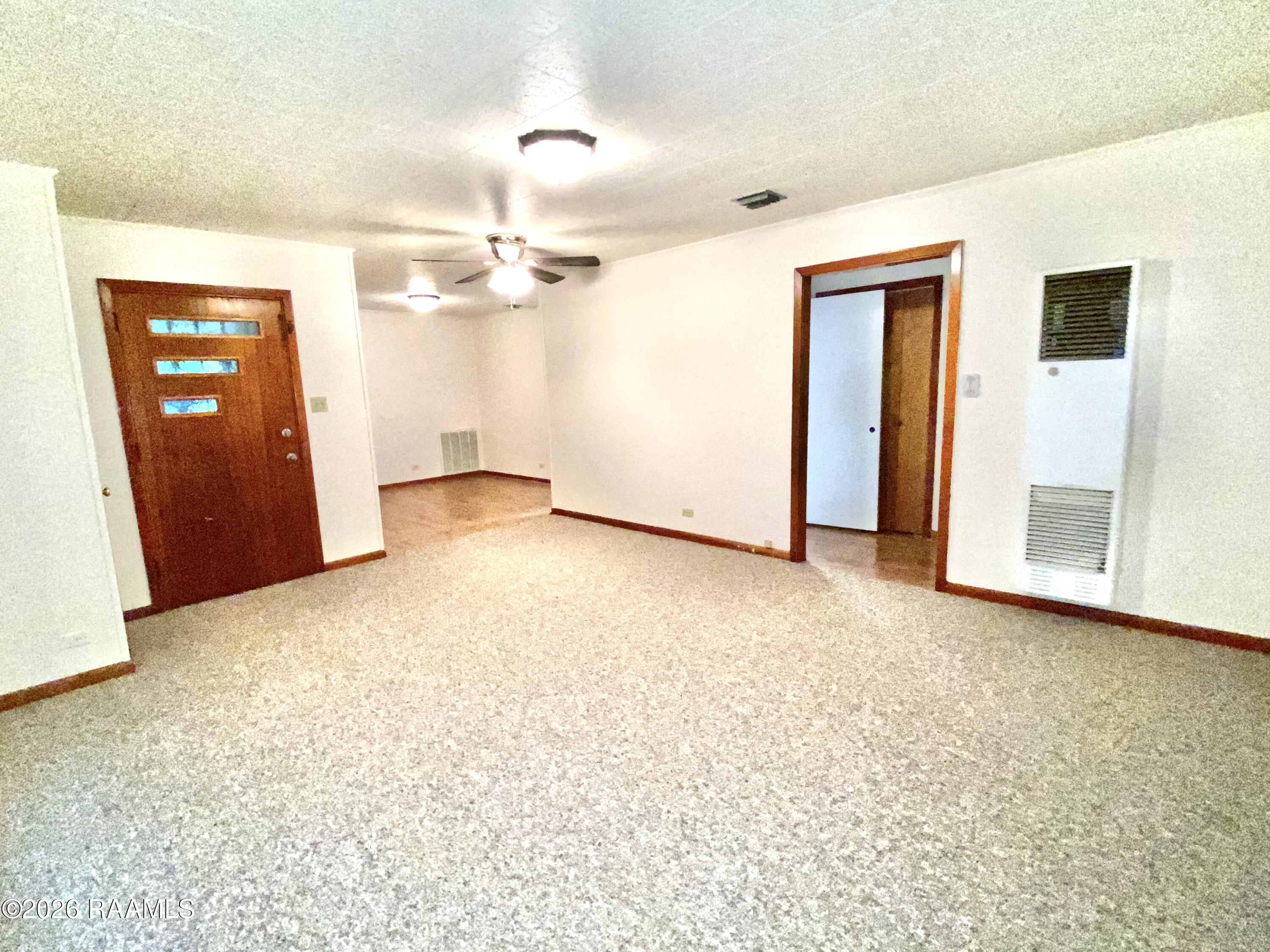 801 2nd, Unit A Rayne, LA 70578 - Photo 3 of 15 Living Room w Front Door