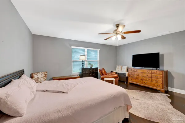 a bedroom with a bed and a couch