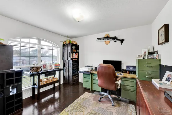 a work room with furniture and a window
